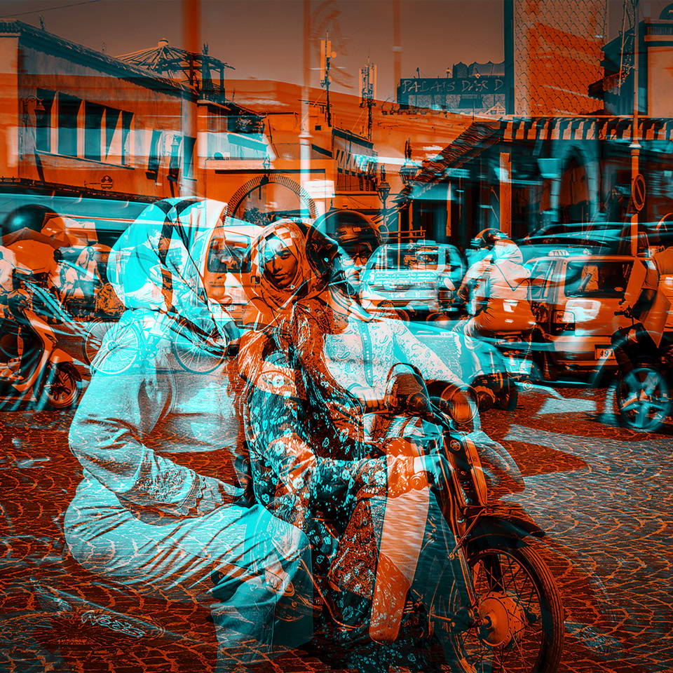 A digitally altered image showing multiple people on motorcycles in a busy street scene, with buildings and cars in the background, overlaid with a red and blue color effect.